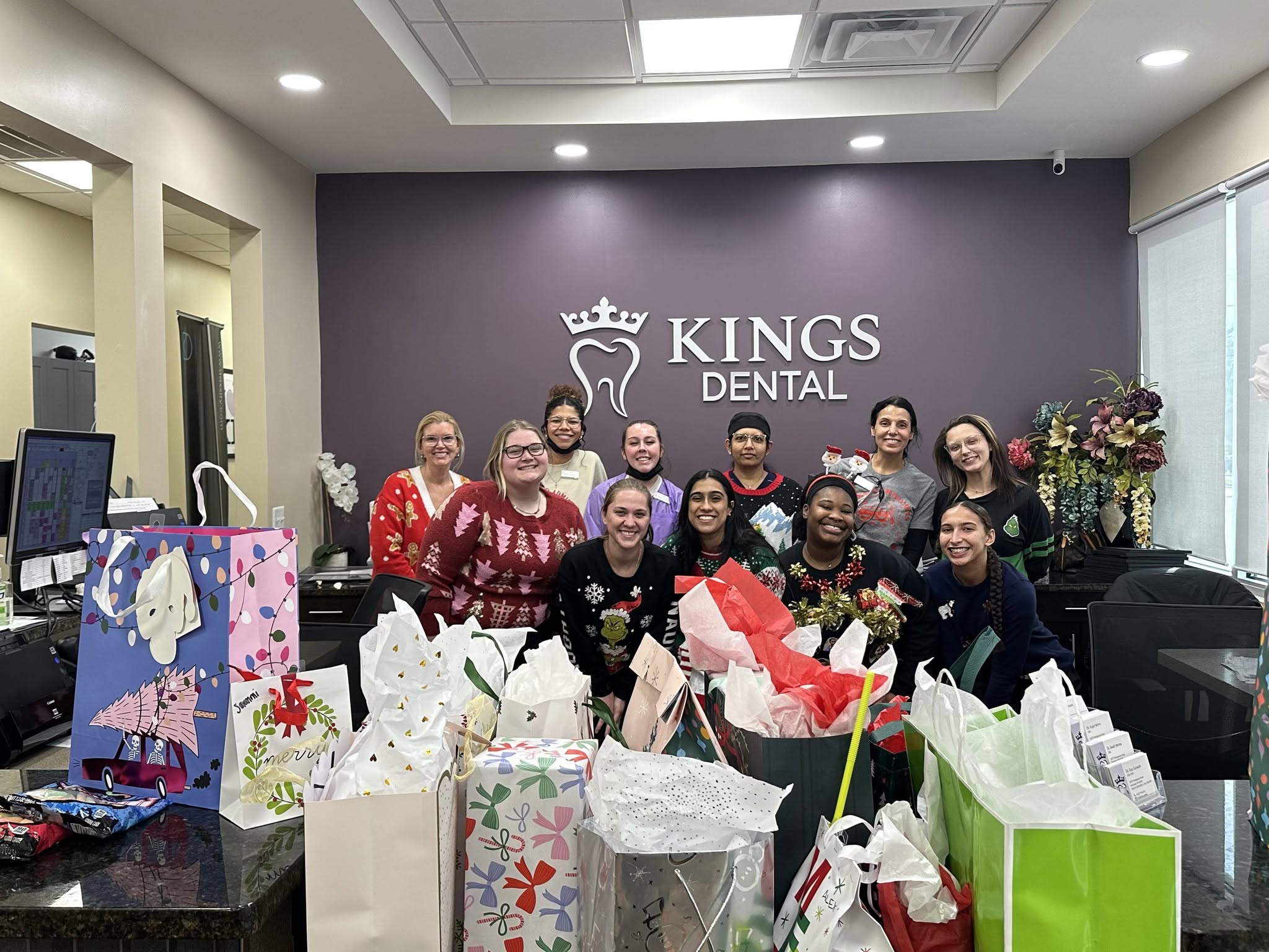 Kings Dental team celebrating together