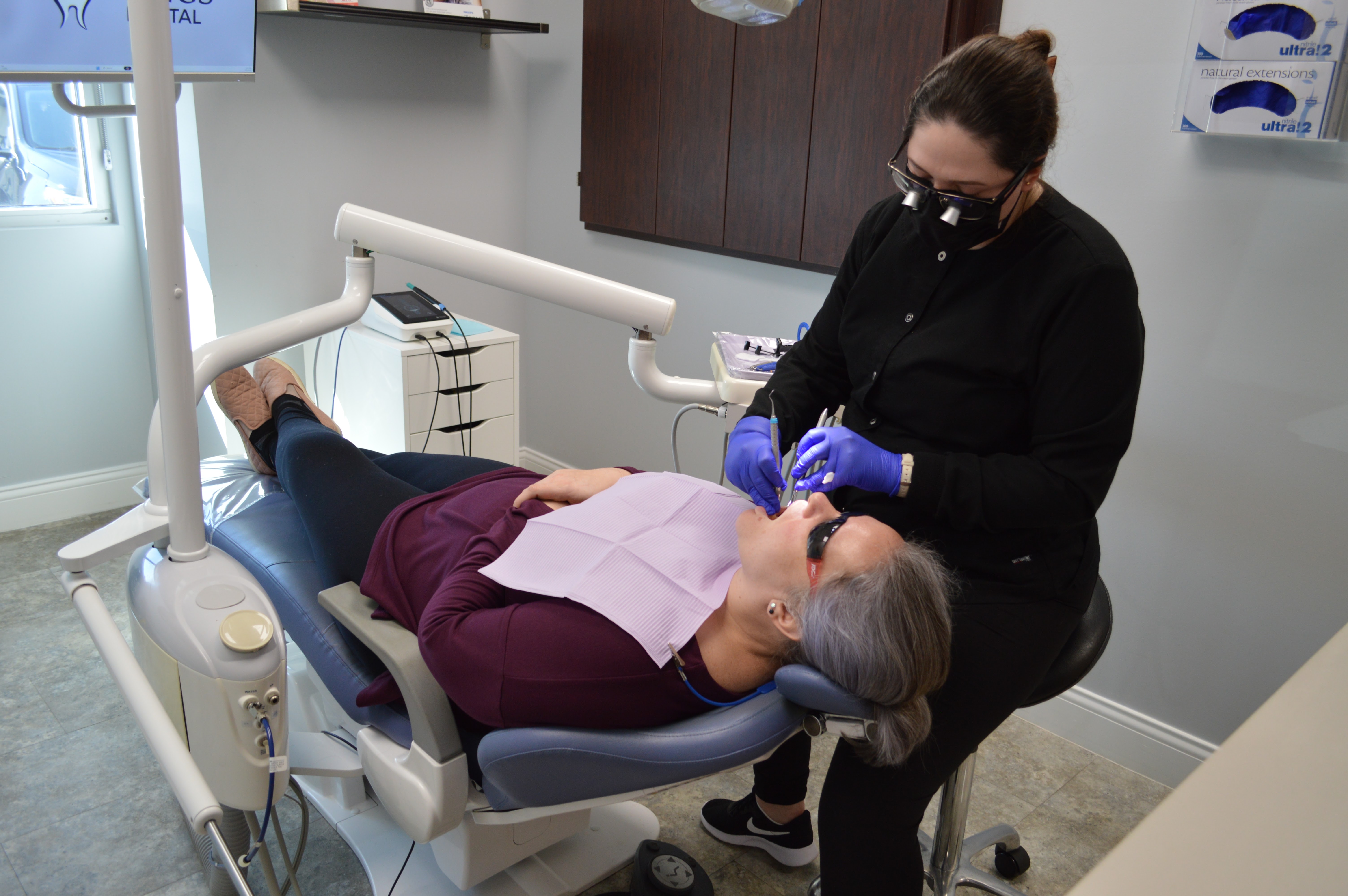 Kings Dental dentist treating a patient