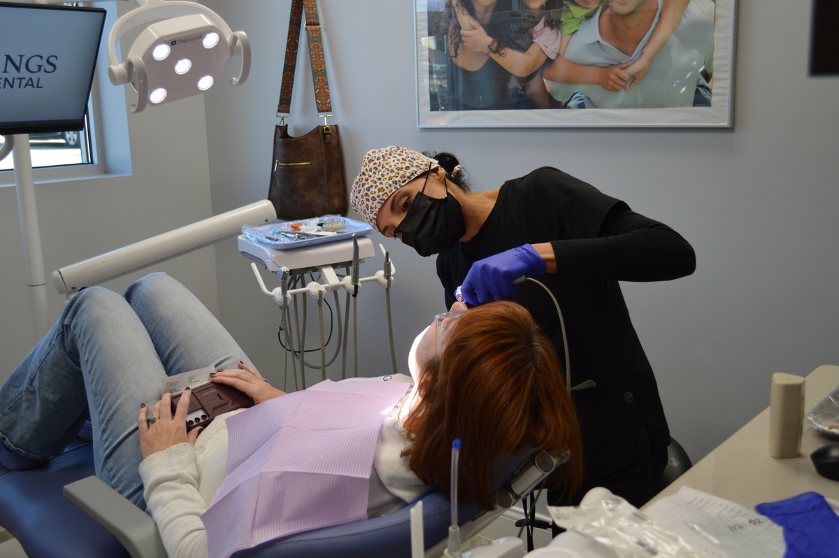 Nurse and Dental patient teeth cleaning